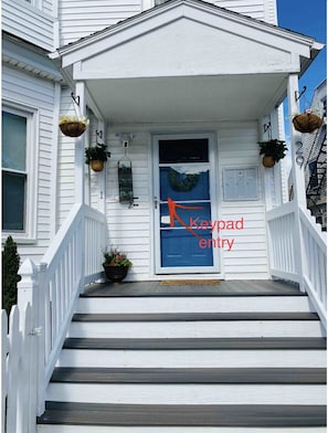 Look for "BLUE" door for keypad entry . *Outdoor security camera present.*