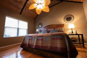 Main bedroom - wood finished vaulted ceilings, just like the family room