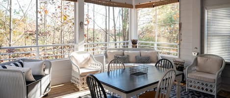 Rain or Shine - Enjoy this screened porch with dining area and 55 in HDTV!