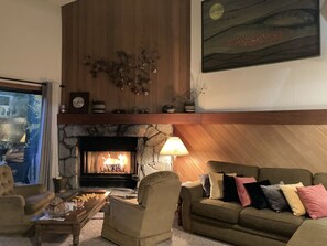 Inviting living room designed for ultimate relaxation. Unwind on plush seating, enjoy the warm glow of ambient lighting, and savor moments of connection or quiet after a long day. Perfect for movie nights, board games, or simply lounging in comfort.
