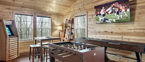 play foosball and watch the game