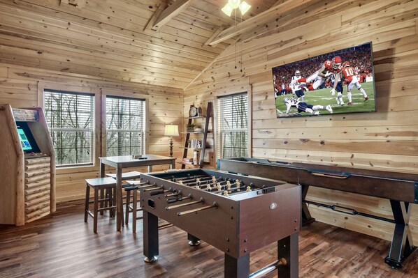play foosball and watch the game