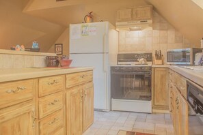 Full kitchen with all the amenities. Including standard coffee maker with metal reusable filter.