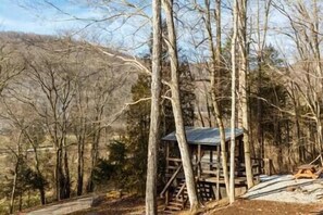 Daytime Cabin Showing Private Outdoor Picnic Table and Firepit