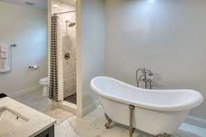 Updated upstairs bathroom with clawfoot tub, walk in shower and dual sinks.