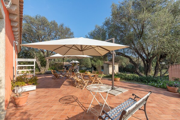 Outside shared terrace with private chairs and table