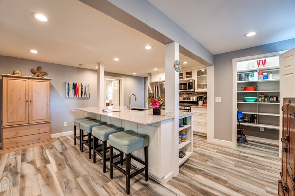 Large Open Kitchen -- plenty of pantry storage, counter space - and bar counter seating