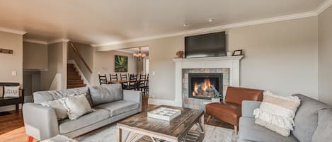 Large main level living area, opening up to dining space.