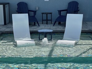 Daytime view of the Ledge lounger chairs with bubbler on the sun shelf. 