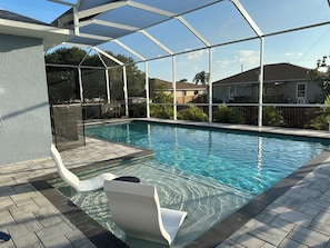 Daytime view of the deep end (5' 6") next to the sunshelf (3").