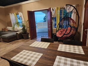 cozy living room area with relaxing sea breeze while you lounge with a good book