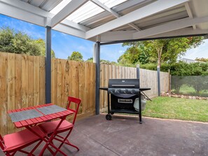 Outdoor table and chairs and BBQ area