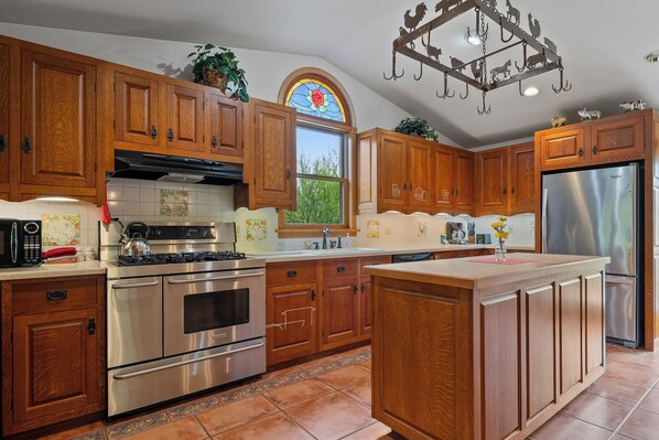 Kitchen cabinets were hand crafted from cherry wood by the owner's father