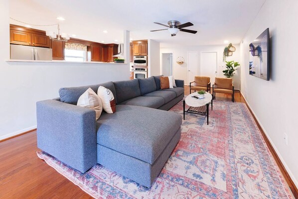 Living room with 7 person sofa & two lazy chairs