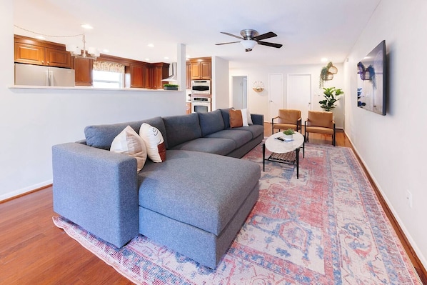 Living room with 7 person sofa & two lazy chairs