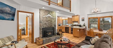 Living Room with leather furniture and wood stove.