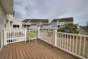 Enjoy some quiet time on the back deck with a drink.