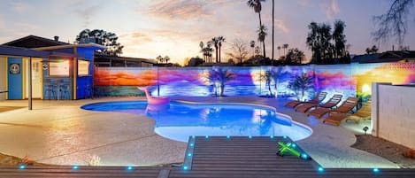 You will feel like you are oceanside with the Sunset mural and large pier to dangle your feet in the amazing pool!