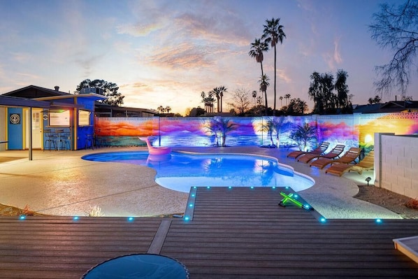 You will feel like you are oceanside with the Sunset mural and large pier to dangle your feet in the amazing pool!
