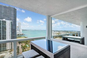 Fully furnished balcony with waster views of Biscayne Bay and Park views