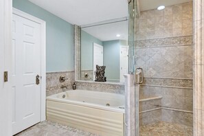 Separate shower and tub in the master bathroom.