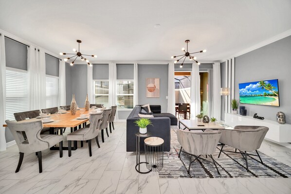 The living/dining area is a harmonious blend of style and comfort. With contemporary furnishings, a chic color palette, and ample natural light, this space invites you to relax and entertain.