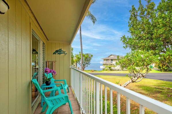Alii Kai 1201 Kauai Vacation Condo - The wrap-around lanai has comfortable, colorful seating for you to lounge in while looking out at the waves. Enjoy a morning cuppa, an evening Chardonnay, or some afternoon meditation out here!