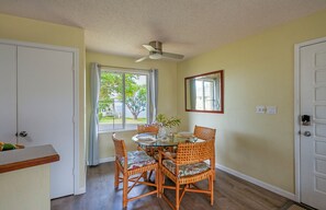 Alii Kai 1201 Rental Condo - The dining area has a peekaboo ocean view through the oversized window, perfect for enjoying an oceanfront meal from the comfort of your home-away-from-home!