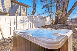 Private hot tub in backyard of Union Crossroads home