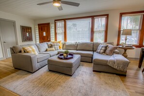 Bright living room with sectional offering seating for six (sleeper sofa for 2)