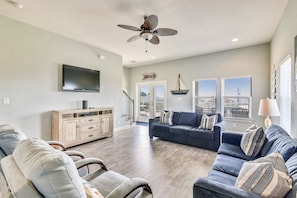 Windows Galore - The large, elegant windows allow the living room to be filled with lots of natural lighting.