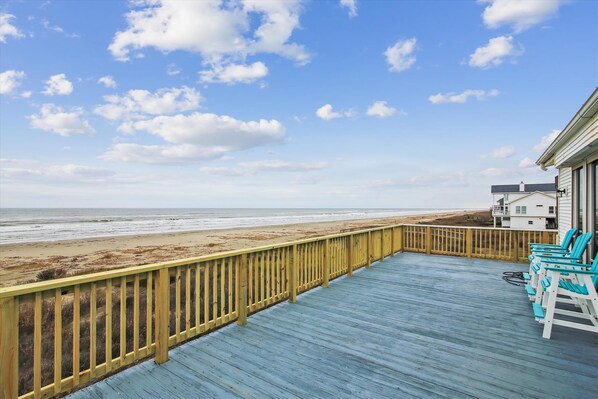 Large Patio - Our spacious patio is the perfect place to gather the family and enjoy the beautiful yard. The salt-laced breezes are definitely a plus!