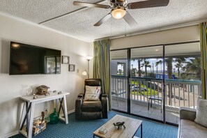Spacious Living Room - Large comfortable couches, a flat screen TV, and ceiling fan so you can enjoy your evenings with family and lots of breathing space.