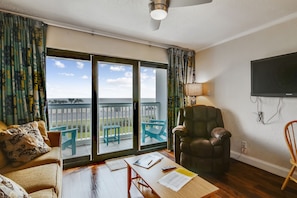 Family Room with a View - Enjoy sitting on the couch and playing a game of cards or watching the waves crash on the beach.