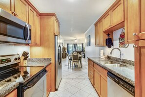 Stay Connected - Enjoy a family meal or a snack while chatting with the cook! The kitchen table is conveniently located next to all of the action.