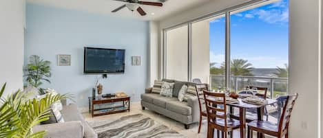 Windows Galore - The large, elegant windows allow the living room to be filled with lots of natural lighting.