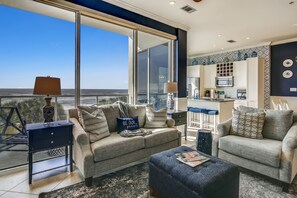 Windows Galore - The large, elegant windows allow the living room to be filled with lots of natural lighting.