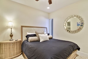 Primary Bedroom - Retire for the night after a long day at the beach in the plush king-size bed in the primary bedroom.