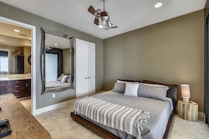 Primary Retreat - The primary bedroom with king-sized bed, en-suite bathroom, and flat-screen television makes for the perfect place to unwind after a long day.