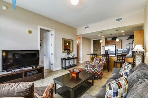 Spacious Living Room - Large comfortable couches, a flat screen TV, and ceiling fan so you can enjoy your evenings with family and lots of breathing space.