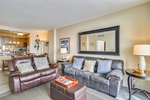 Spacious Living Room - Large comfortable couches, a flat screen TV, and ceiling fan so you can enjoy your evenings with family and lots of breathing space.