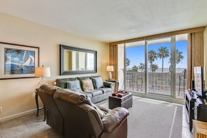 The living room’s view is spectacular - The airy living room opens onto the balcony, which in turn overlooks the soft white sands and the serene beach. You'll love the area with its bountiful wildlife, estuaries, and biking.