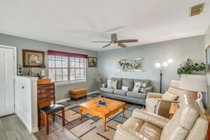 Spacious Living Room - Large comfortable couches, a flat screen TV, and ceiling fan so you can enjoy your evenings with family and lots of breathing space.