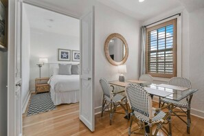 Dining area in the living room. Entrance to the bedroom