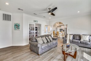 Living Area - From the large, elegant windows to the attractive furniture, you and your guests will love spending time together in this bright and airy living area.