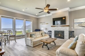 Living Area - From the large, elegant windows to the attractive furniture, you and your guests will love spending time together in this bright and airy living area.