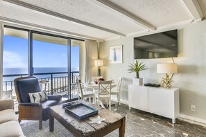 Windows Galore - The large, elegant windows allow the living room to be filled with lots of natural lighting.