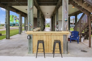 Large Patio - Our spacious patio is the perfect place to gather the family and enjoy the beautiful yard. The salt-laced breezes are definitely a plus!