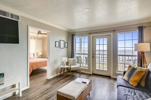 Spacious Living Room - Large comfortable couches, a flat screen TV, and ceiling fan so you can enjoy your evenings with family and lots of breathing space.