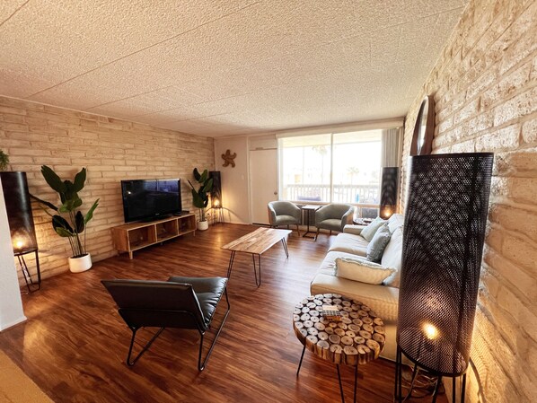 Living Room with outside Balcony overlooking the pool.